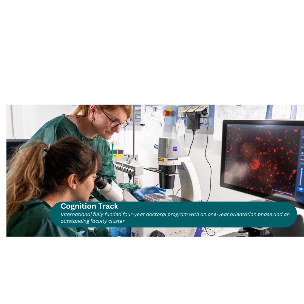 Two female scientists in a laboratory setting look at a microscope.