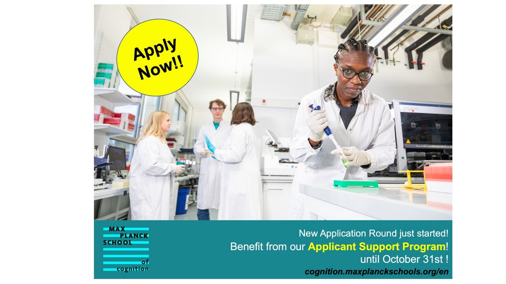 A lab setup with several people in the background and one person with a pipette in the front.